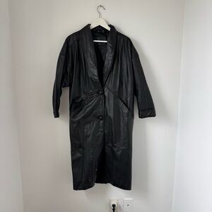 Sleek Black Leather Jacket with Oversized Design